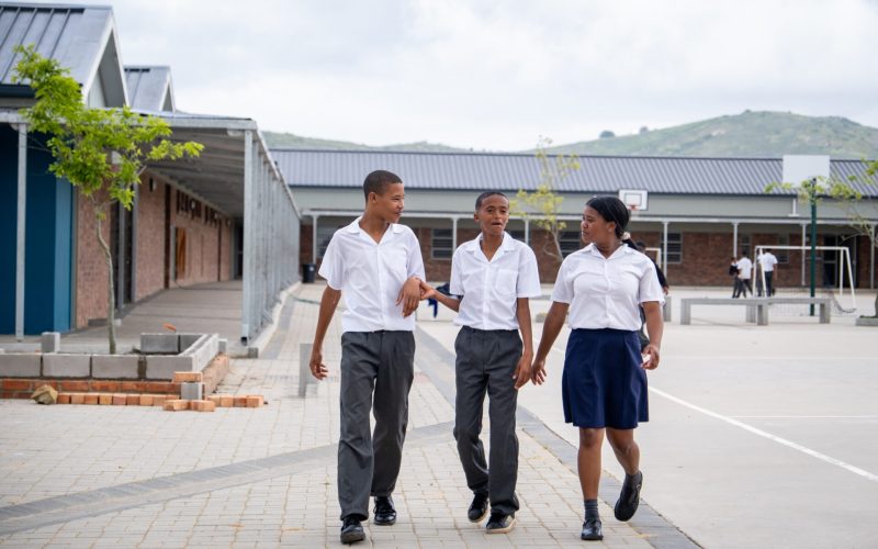 Group of African schoolfriends from a rural school near Cape Town enjoy their school lunch break